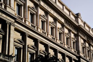 Sunlit facade of the iconic Banca d'Italia in Rome, showcasing classic architecture.