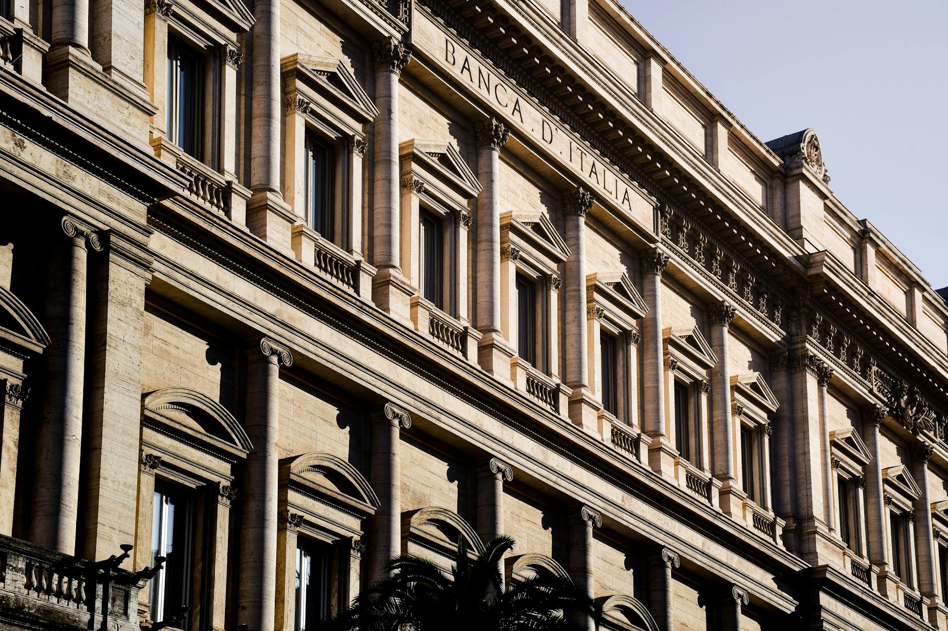Sunlit facade of the iconic Banca d'Italia in Rome, showcasing classic architecture.